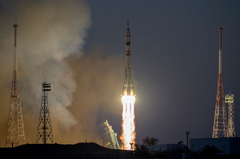 Soyuz docks to space station with NASA astronaut and 2 cosmonauts aboard