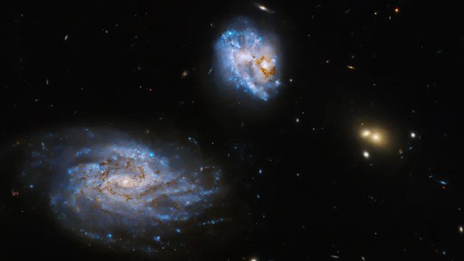 Hubble Space Telescope Observes Illuminated Stars in Colliding Galaxies