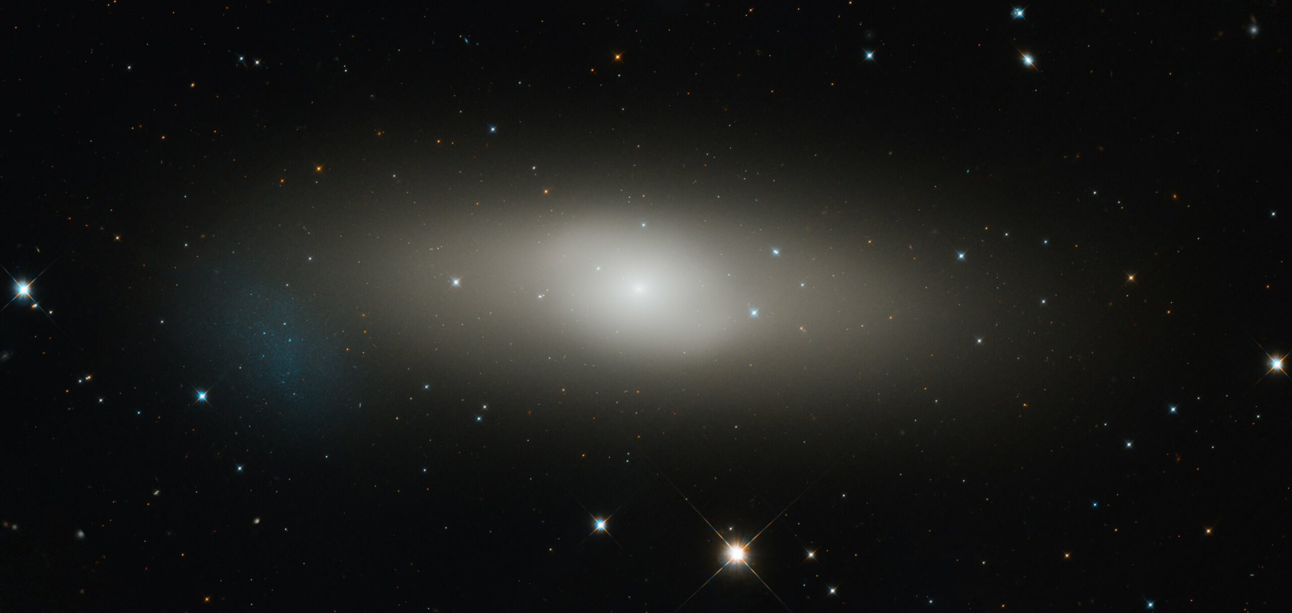 The attention of the Hubble telescope is directed towards the expansive lenticular galaxy 1023.
