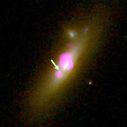Uncommon Galaxy Housing Two Black Holes, One Deprived of Stars